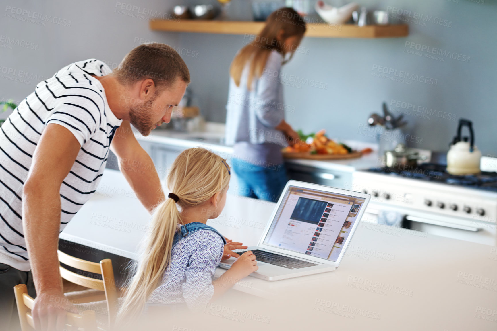 Buy stock photo Rearview of a dad helping his little girl out with the laptop
