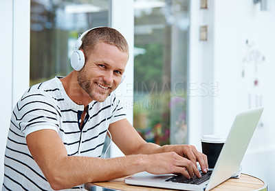 Buy stock photo Portrait of a  handsome young man working outside on a laptop