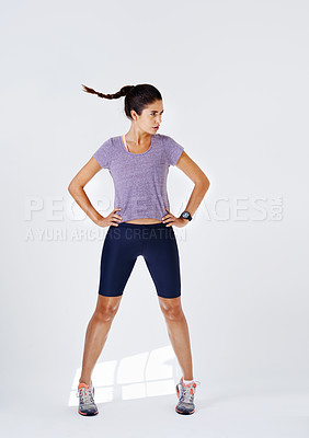 Buy stock photo Woman, fitness and wind with workout in studio on white background on confidence and isolated. Female person, sweat and body on exercise, training and serious for health and wellness in sportswear