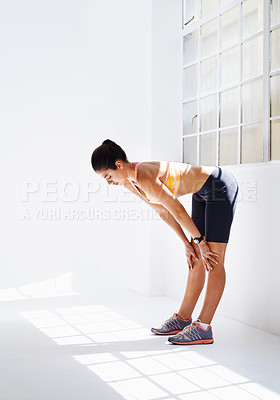 Buy stock photo Studio shot of an attractive young woman working out