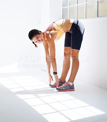 Buy stock photo Studio shot of an attractive young woman working out