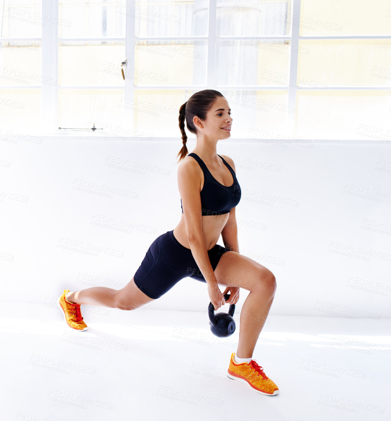 Buy stock photo Exercise, kettlebell and woman with workout, stretching and training on white studio background. Happy person, model or athlete with equipment, wellness and power with endurance, strength or balance