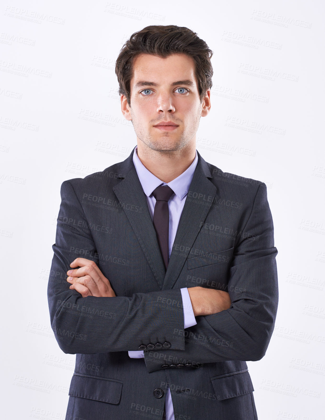 Buy stock photo Portrait of a focused businessman with an ambitious attitude standing with his arms crossed isolated against a white background. A Successful business leader looking confident while wearing a suit