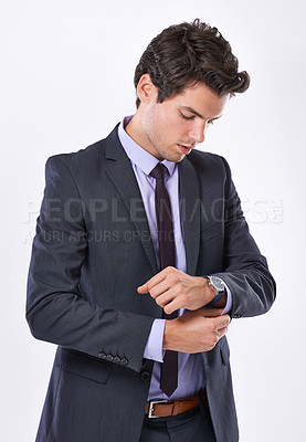 Buy stock photo Businessman, watch and time with suit for deadline, schedule or action plan in studio on a white background. Man, model or employee checking wristwatch in formal or business attire for appointment