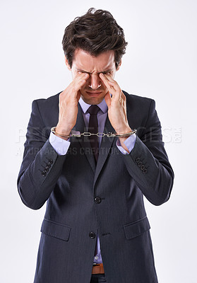 Buy stock photo Businessman, handcuffs and fraud with stress for crime or ponzi scheme on a white studio background. Frustrated man or employee in arrest or restraint for embezzlement nepotism lawsuit or corruption