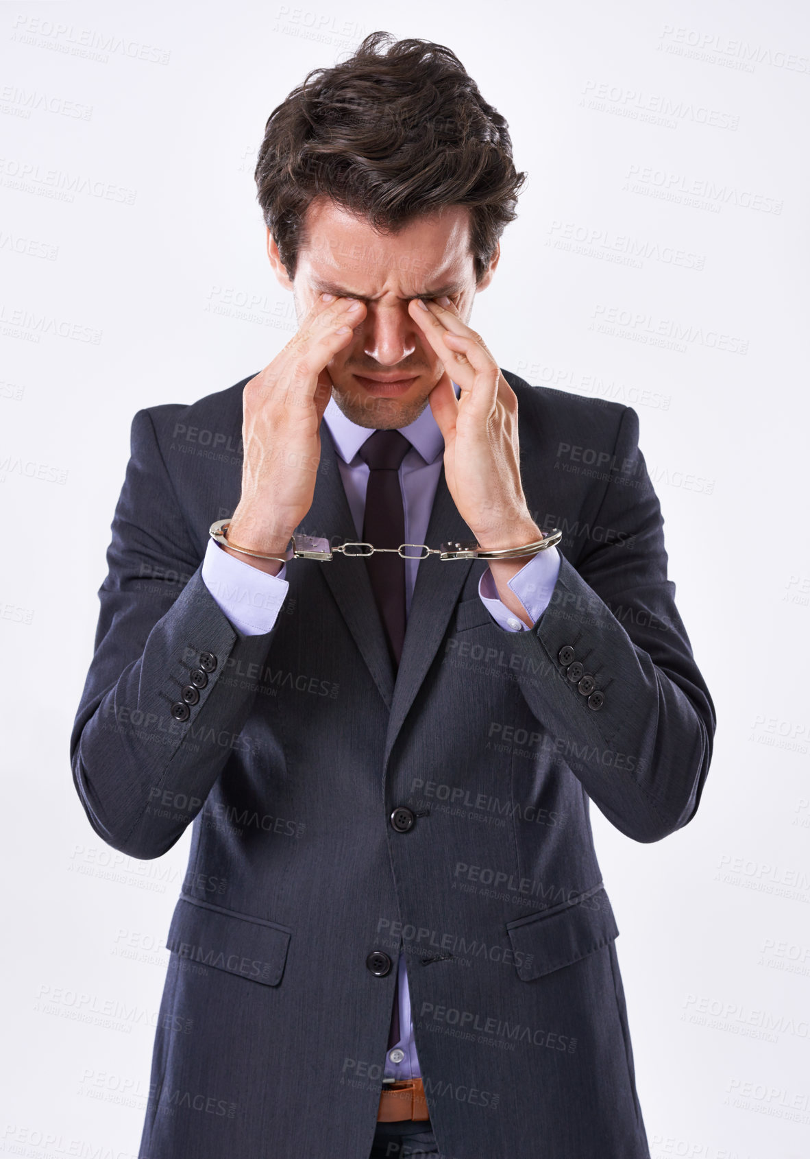 Buy stock photo Businessman, handcuffs and fraud with stress for crime or ponzi scheme on a white studio background. Frustrated man or employee in arrest or restraint for embezzlement nepotism lawsuit or corruption