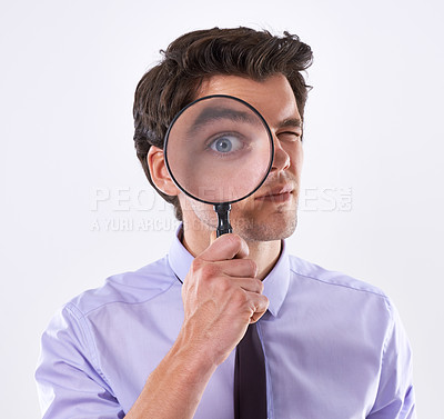 Buy stock photo Portrait, eye and business man with magnifying glass, investigator and audit at company on white studio background. Face, male employee and PI with compliance and fair trade evidence or information