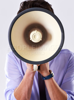 Buy stock photo Business person, loud and megaphone in studio for communication, announcement or breaking news. Employee, noise and loudspeaker on white background for broadcast, warning and corporate information