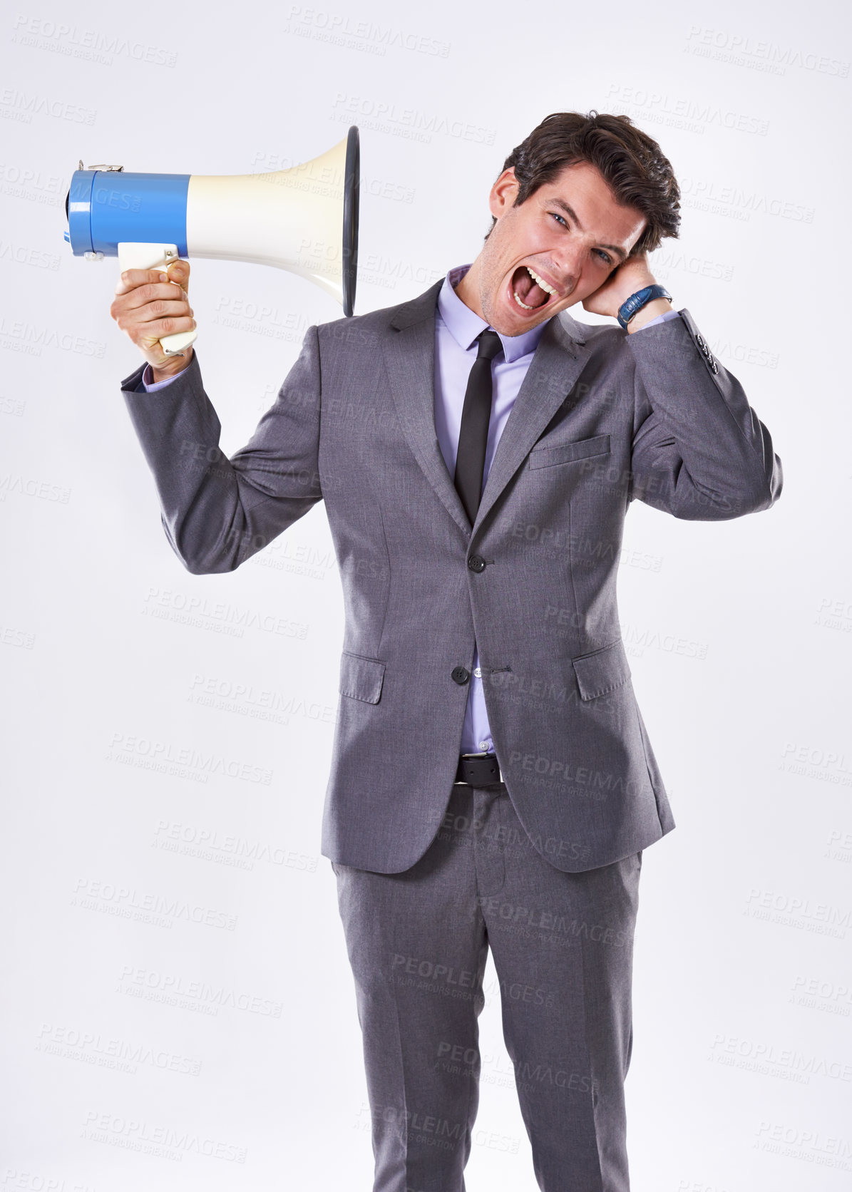 Buy stock photo Business man, ear and megaphone in studio for communication, announcement and breaking news. Employee, frustrated and loudspeaker on white background for broadcast, warning and corporate propaganda