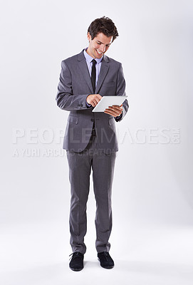 Buy stock photo Businessman, tablet and studio for networking client, online communication and white background. Male person, financial plan and planning for schedule reminder, broker and website for stocks report