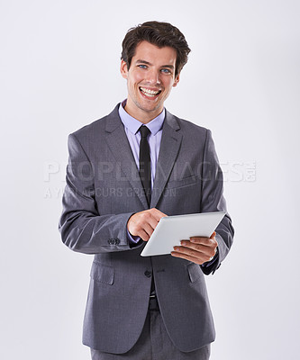 Buy stock photo Tablet, portrait and businessman smile in studio for online research, website review and social media. White background, corporate and worker on digital technology for email, internet or networking