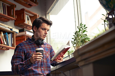 Buy stock photo Learning, student or man reading book at cafe for literature, education or history on campus. Break, drink or person studying english novel for journalism at coffee shop for tea beverage or research