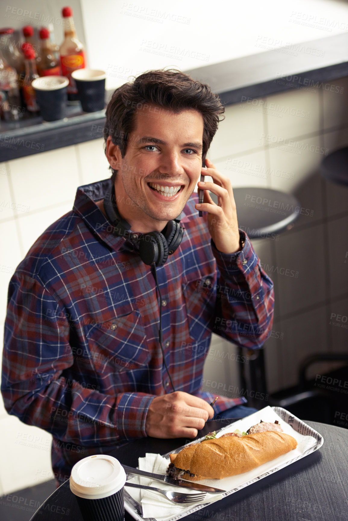 Buy stock photo Portrait, phone call and man in cafe networking on social media, mobile app or internet. Research, technology and male freelancer with coffee and happiness on cellphone in restaurant with sandwich