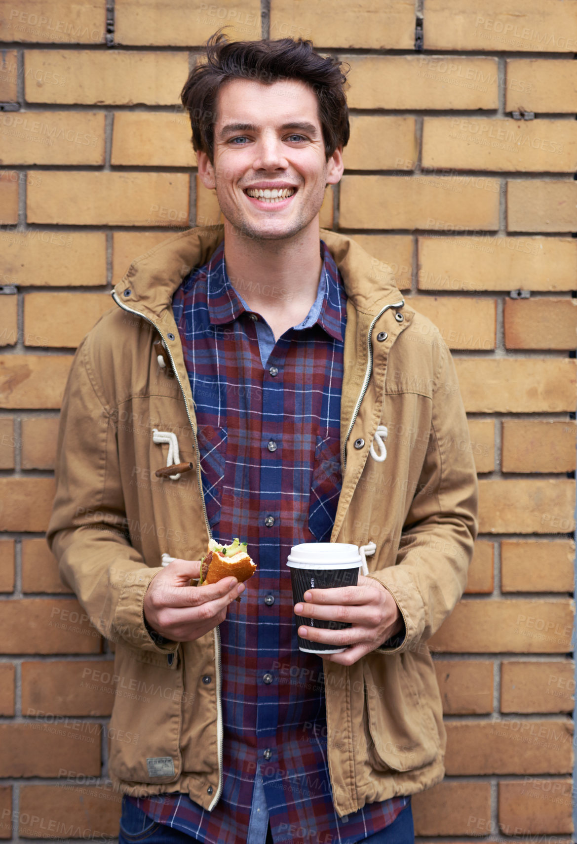 Buy stock photo Portrait, happy man and outdoor with takeaway coffee on wall for breakfast, food or morning as web designer. Male person, smile and lunch for nutrition, wellness or meal at company or digital agency