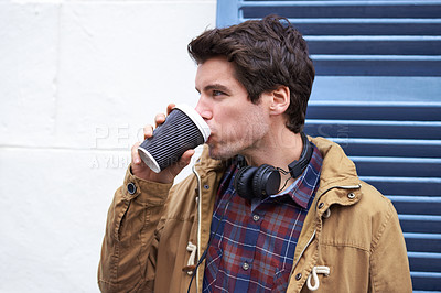 Buy stock photo Man, outdoor and drinking with coffee cup takeaway on wall for breakfast, relax and morning in New York. Male person, break and beverage for ideas, thinking or planning in city or urban street in USA