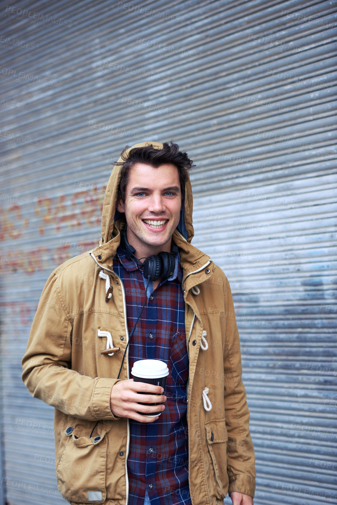 Buy stock photo Outdoor, fashion and portrait of man, smile and commuting in morning, happy and confident with headphones. Road, coffee and winter clothes for person, chilling and joy in New York, cool and stylish
