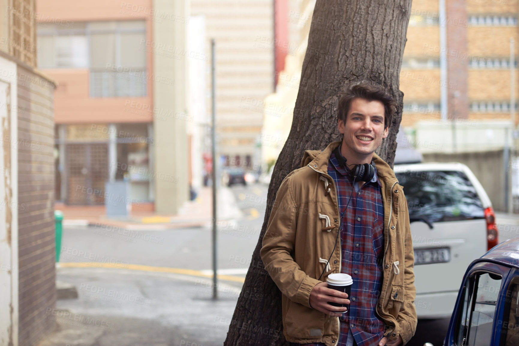Buy stock photo Outdoor, headphones and portrait of man, smile and break in morning, happy and confident on street. Coffee, fashion and winter clothes for person, chilling and joy in New York, cool and stylish