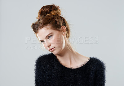 Buy stock photo Cropped studio shot of an attractive young woman wearing a black sweater