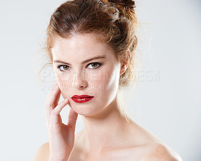 Buy stock photo Cropped studio portrait of a beautiful young woman with bare shoulders