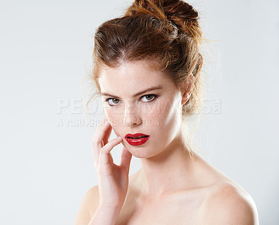 Buy stock photo Cropped studio portrait of a beautiful young woman with bare shoulders
