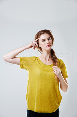 Buy stock photo Studio shot of a casually dressed young woman 