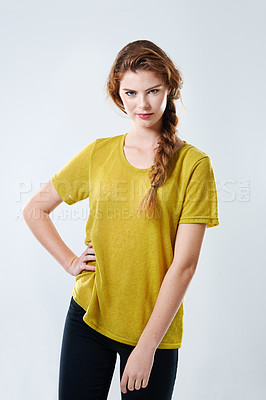 Buy stock photo Model, portrait and casual fashion in studio with tshirt, trendy outfit and edgy expression of creative student. Girl, smile and stylish clothes with aesthetic, pride and woman on white background