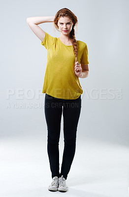 Buy stock photo Woman, portrait casual fashion in studio and tshirt, trendy outfit and natural wardrobe of education pride. Girl, serious and stylish clothes for university, makeup and student on white background