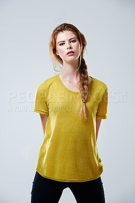 Buy stock photo Studio shot of a beautiful young woman posing in casualwear against a gray background