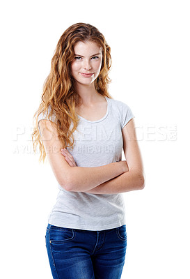 Buy stock photo Portrait of an attractive young woman standing with her arms crossed against a white background. A confident young lady with curly hair wearing white top and blue jeans  in white back ground. 
