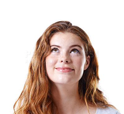 Buy stock photo Portrait of a young woman looking up isolated on white studio background. Pretty girl with bright ideas and imagination. Female with beautiful hazel eyes looking above her head for creative solutions