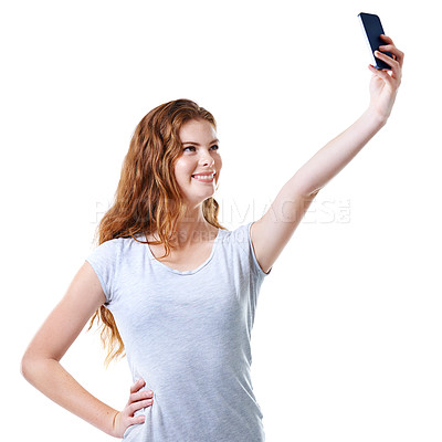 Buy stock photo Studio, smartphone and happy woman on social media with selfie for online dating profile. Smile, scroll and gen z female model browsing on cellphone, internet or website isolated on white background
