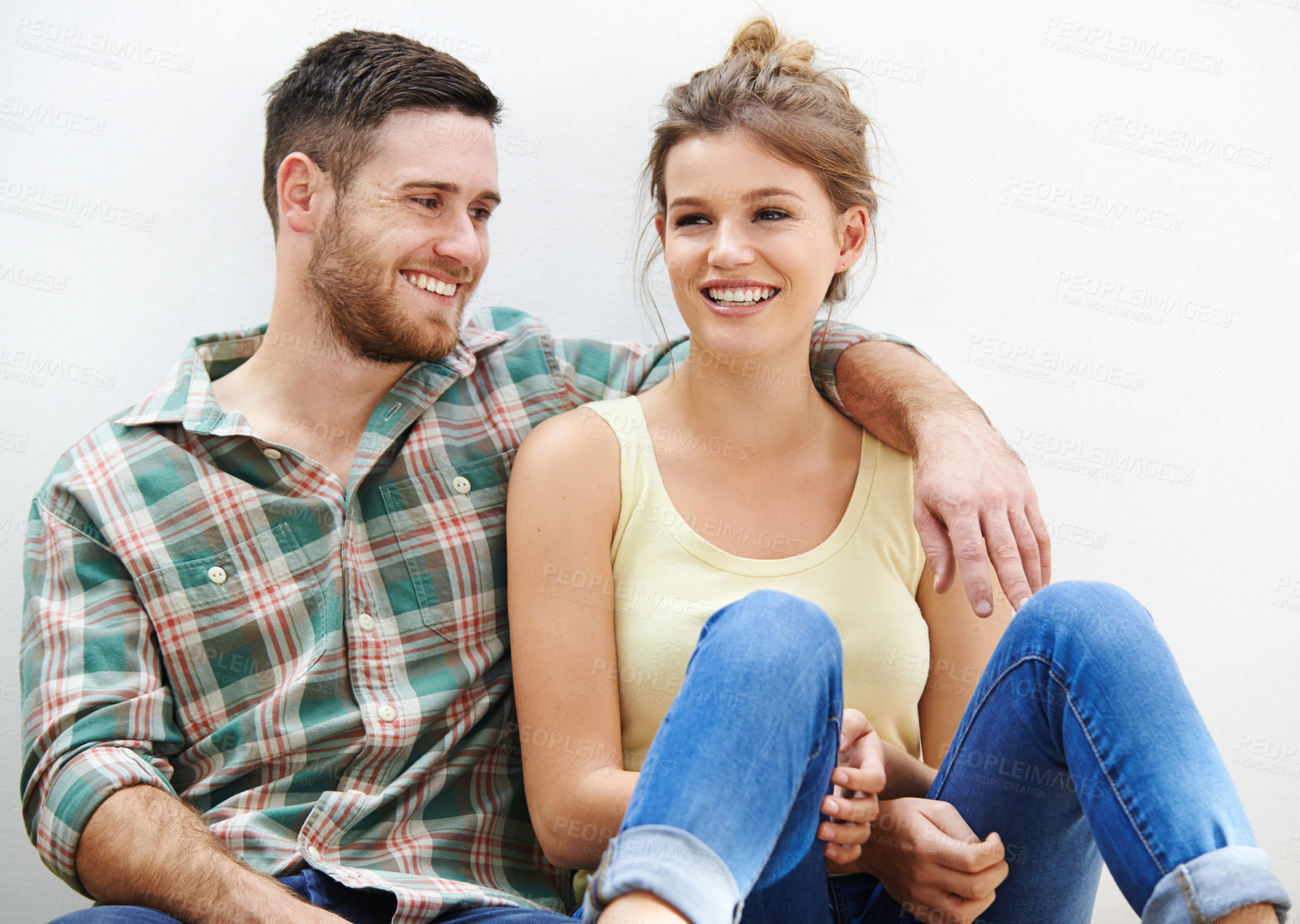 Buy stock photo Couple, hug and relax in house for love, bonding and conversation together with romance on floor. Man, woman and embrace on apartment ground for talking, relationship and chill on weekend with smile