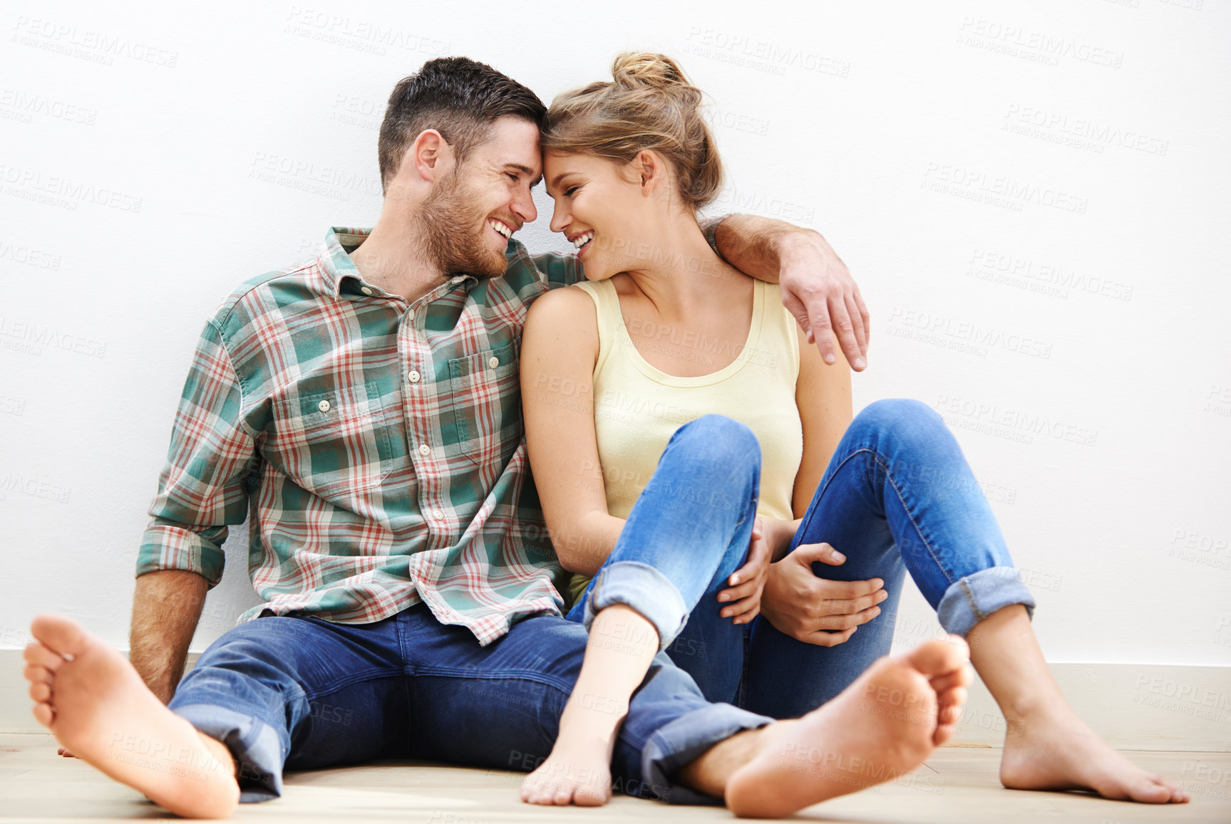 Buy stock photo Couple, hug and relax in house for romance, bonding and love together with connection on floor. Man, woman and embrace on apartment ground for support, relationship and chill on weekend with smile