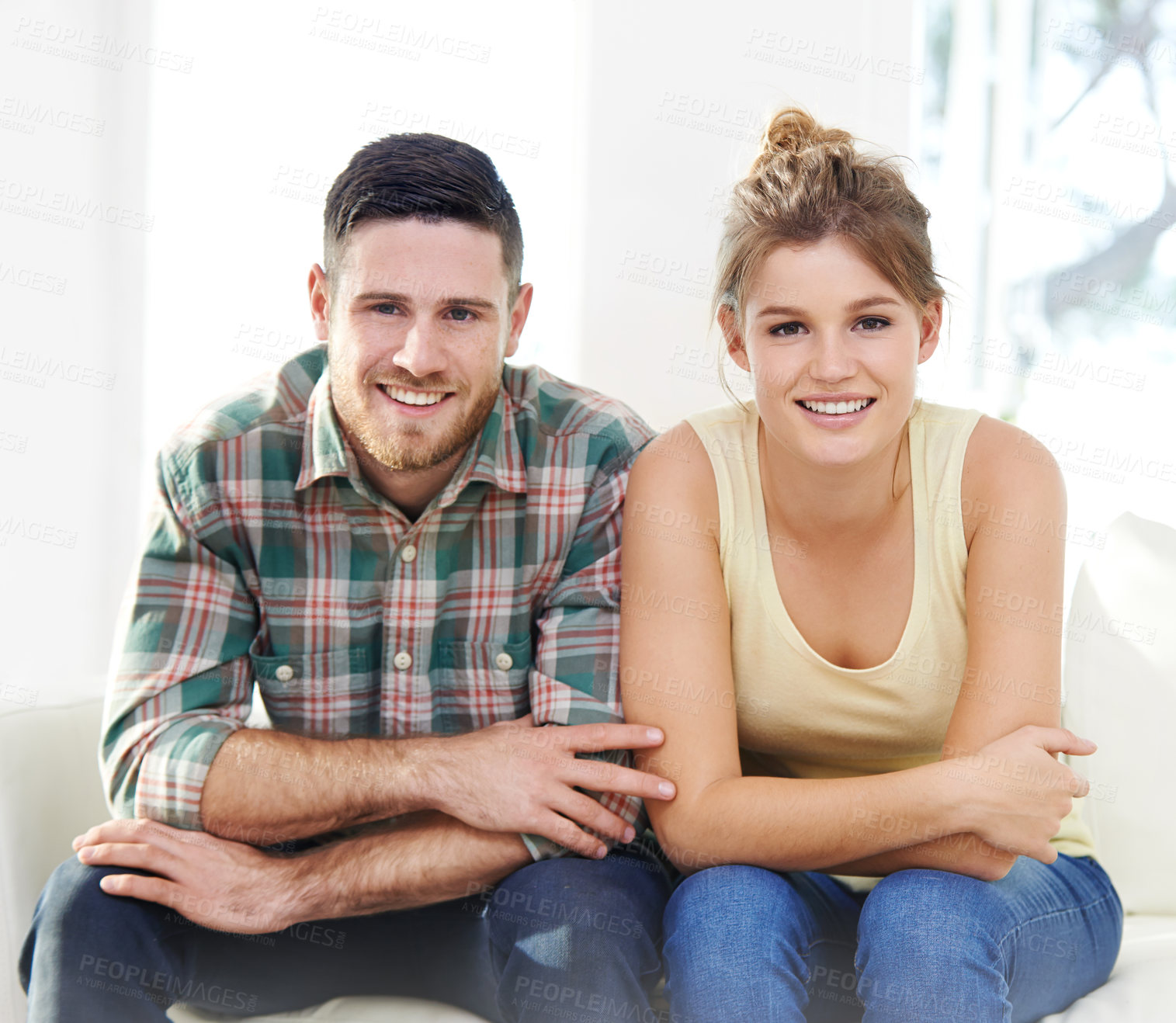 Buy stock photo Happy couple, portrait and relax with sofa for holiday, weekend or bonding together at home. Young man, woman or lovers with smile in satisfaction for day off in casual clothing on couch at house