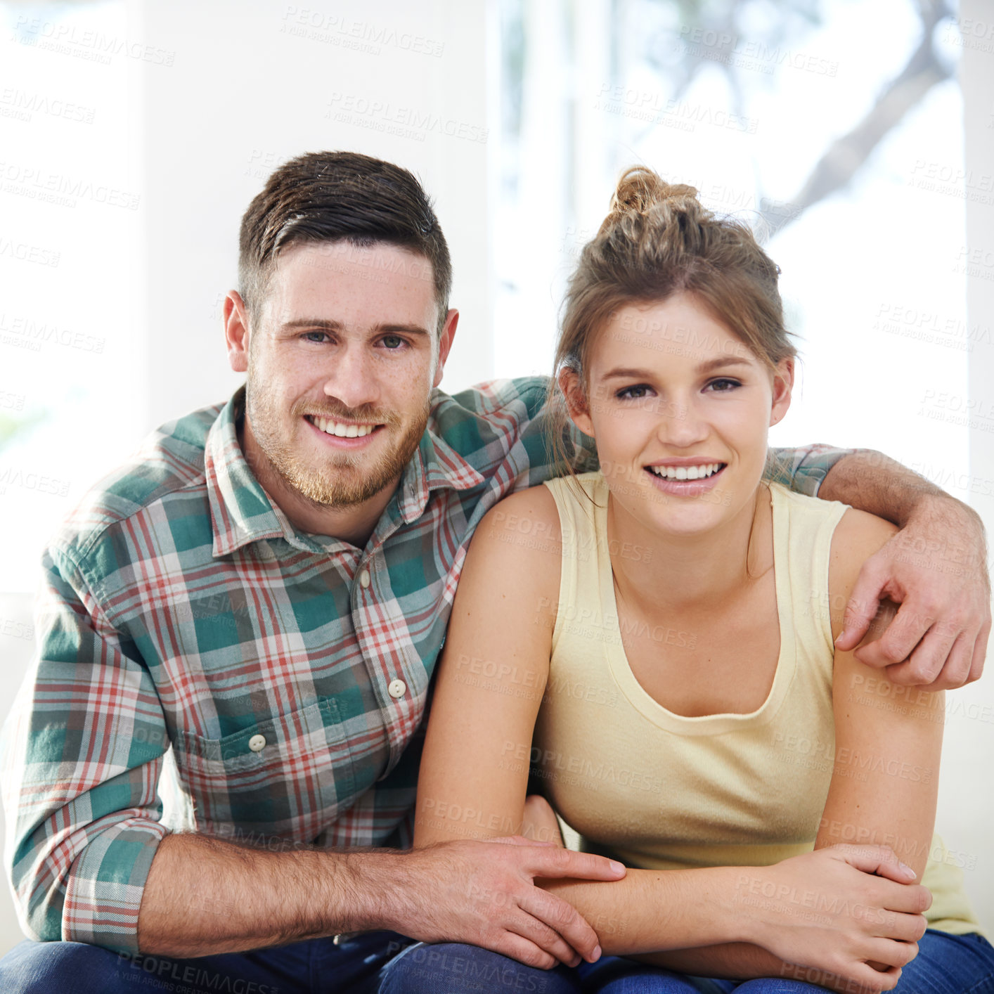 Buy stock photo Portrait, love and happy couple hug in home for support, connection and trust partner for relationship in USA. Face, man and woman embrace for bonding together, commitment and relax in living room