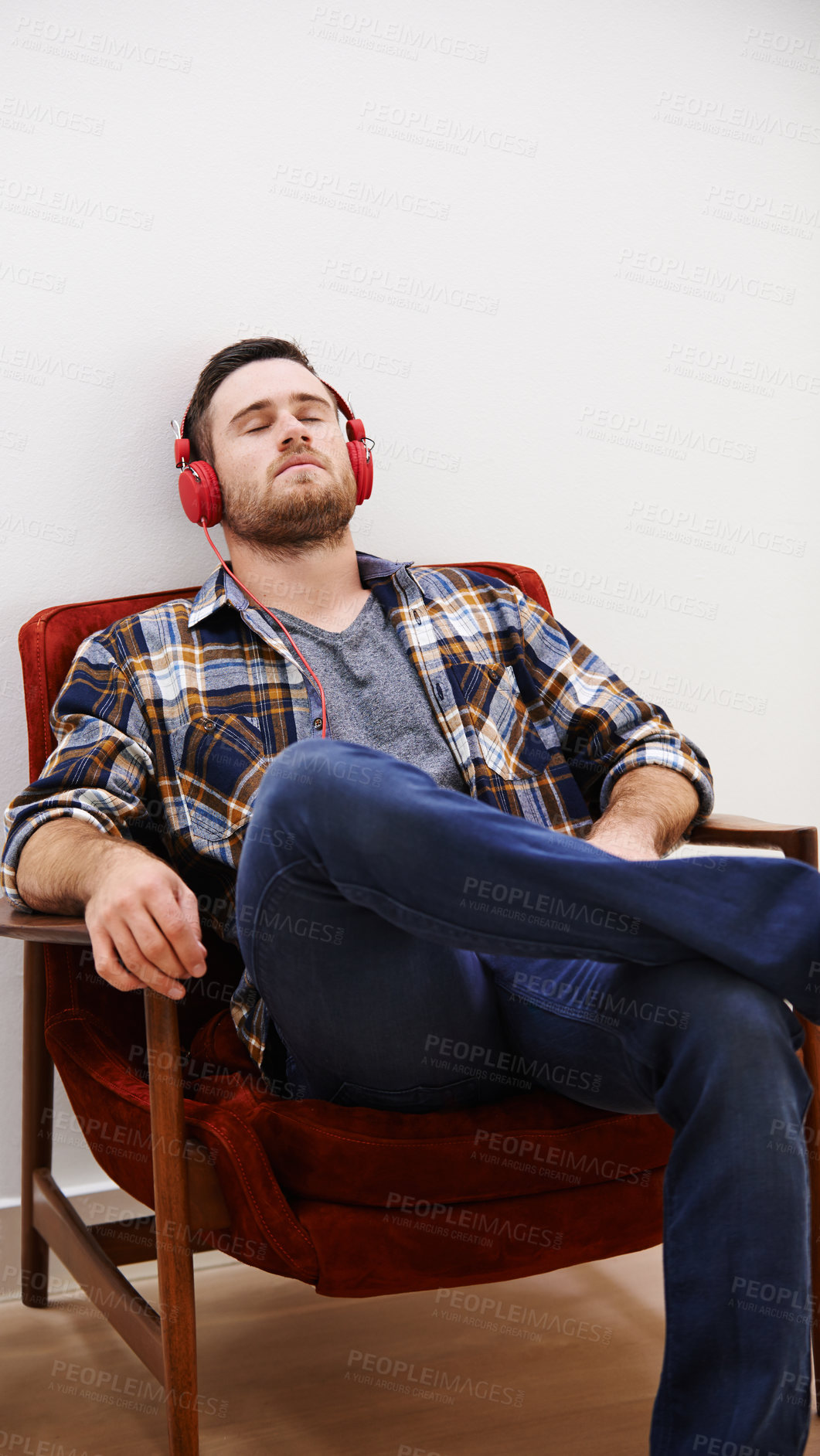 Buy stock photo Man, headphones and rest in living room with music, song or podcast to relax on the weekend at home. Audio, streaming and internet radio with calm track in chair with digital and online listening