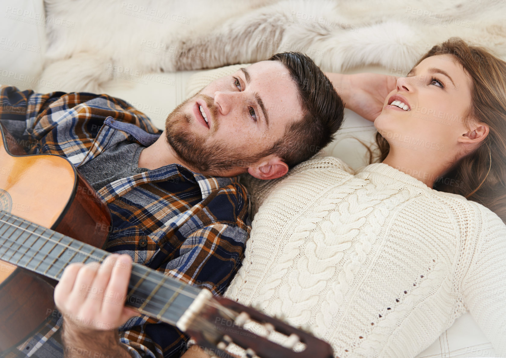 Buy stock photo Happy couple, home and playing guitar for love, together and relationship with joy, support or care  Woman, man and music instrument for bonding, relax and fun in lounge for session, peace and memory