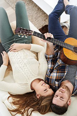 Buy stock photo Above, couple and smile on sofa with guitar for music notes, bonding and love on break at home. People, relationship and happy on couch with instrument for romance, support and trust with care