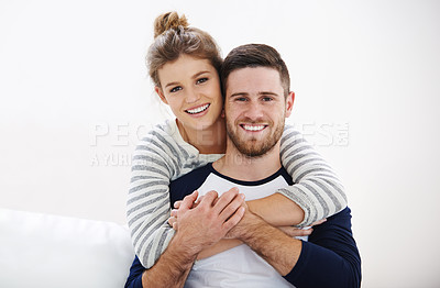Buy stock photo Portrait of a happy young couple relaxing at home together