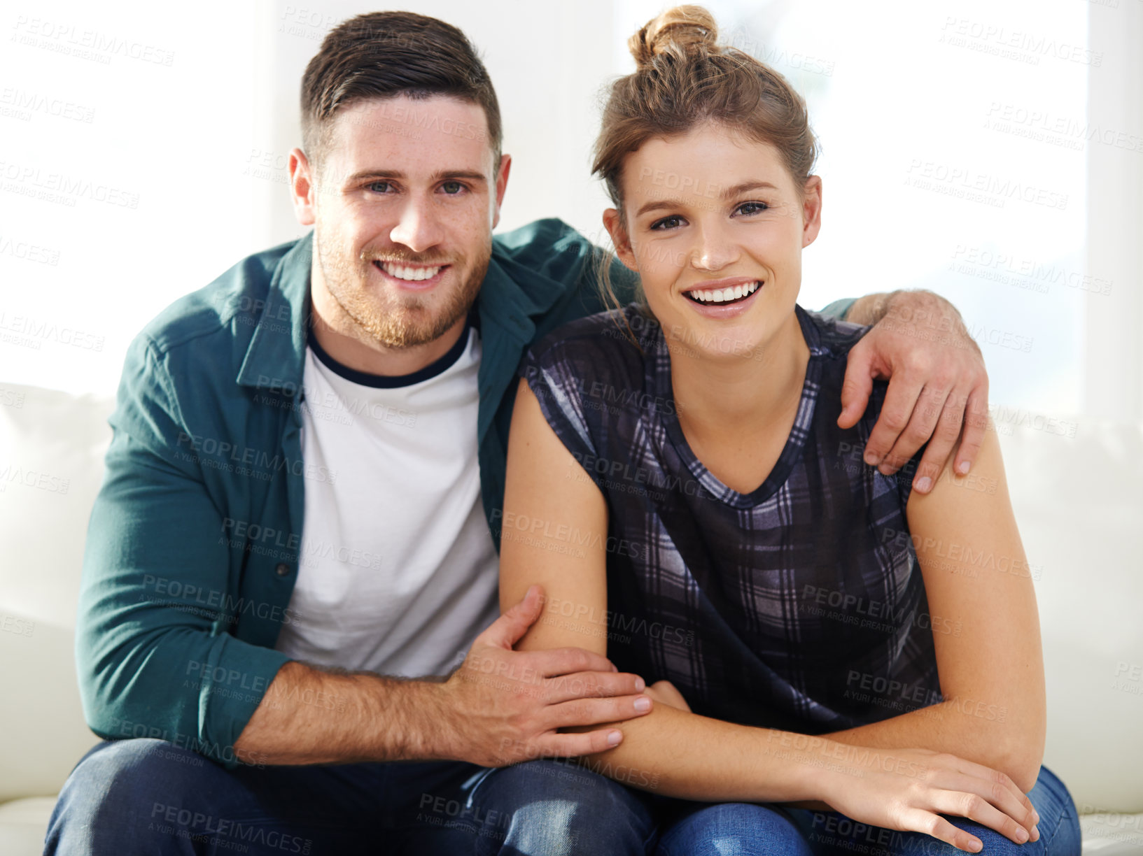 Buy stock photo Portrait, smile and couple hug in home for support, connection and love for partner in relationship in USA. Face, man and woman embrace for bonding together, commitment and relax in living room sofa