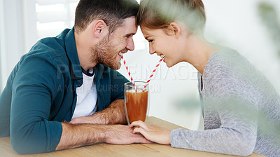 Buy stock photo Love, milkshake and holding hands with couple on date for romance, bonding and cafe. Smoothie, coffee shop and care with man and woman sharing drink at restaurant for summer, break and relationship