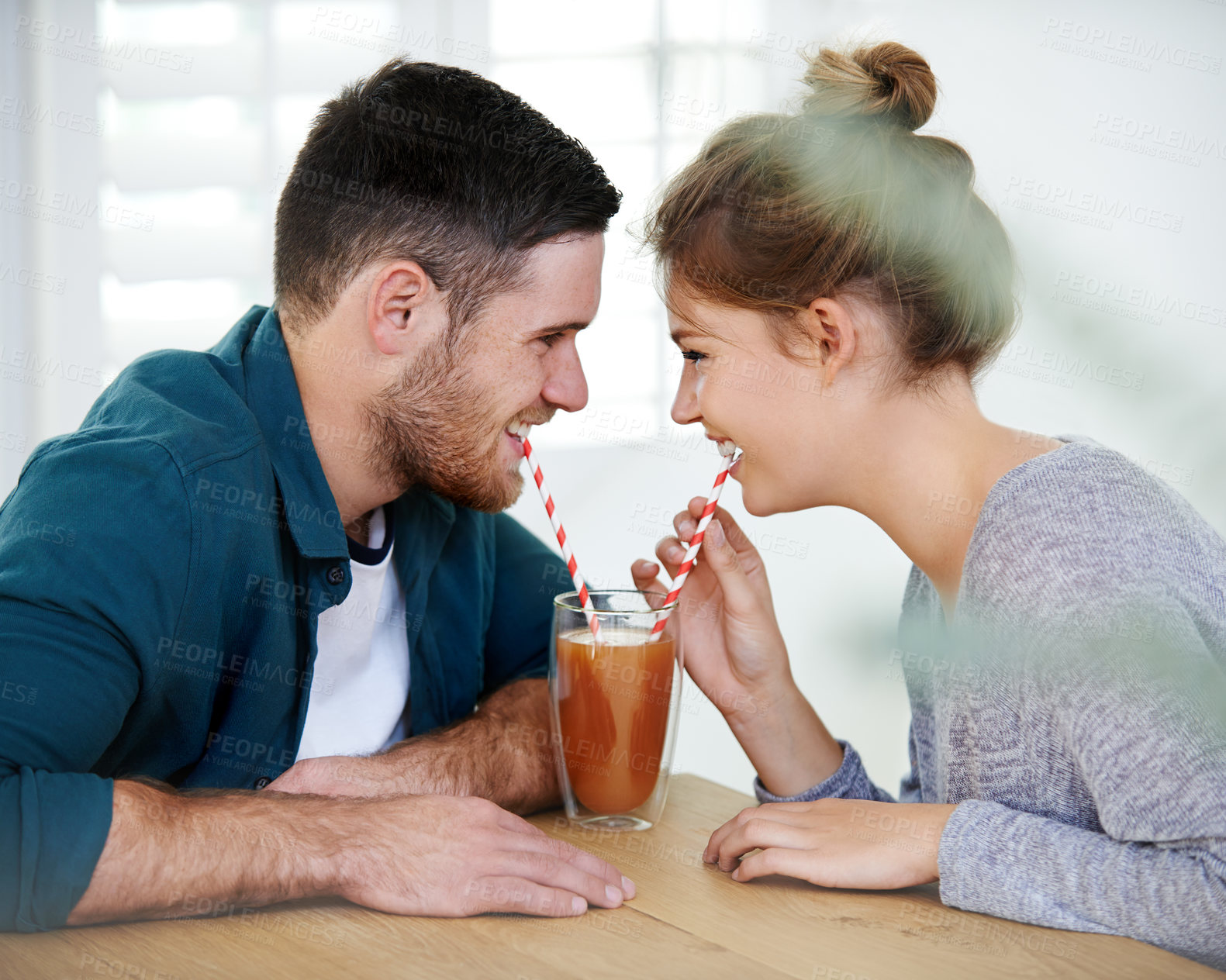 Buy stock photo Love, milkshake and coffee shop with couple on date for romance, bonding and happiness. Smoothie, cafe and care with man and woman sharing drink at restaurant for summer, break and relationship