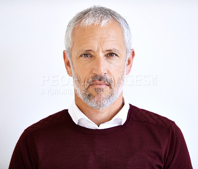 Buy stock photo Portrait of serious mature businessman standing alone, isolated against white background in studio with copyspace. Focused senior professional with assertive attitude. Headshot of corporate executive