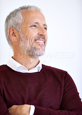 Buy stock photo Studio shot of a handsome mature business standing against a white background