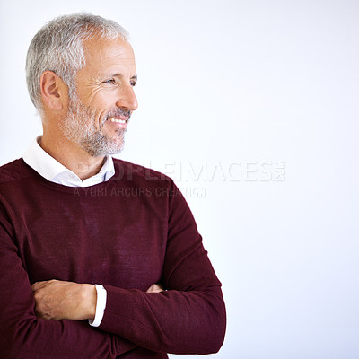 Buy stock photo Studio shot of a handsome mature business standing against a white background