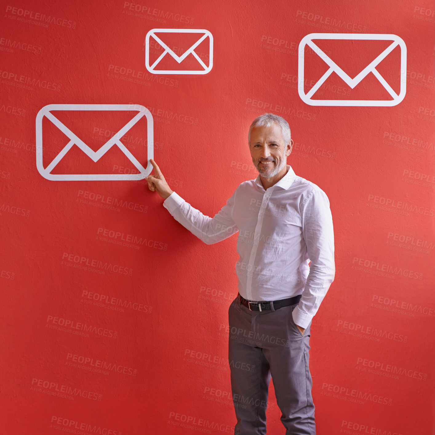 Buy stock photo Mature, happy man and portrait with email, app or envelope for communication, message or online service. Senior, businessman or employee pointing with smile, icon or symbol for presentation on wall