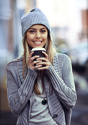 Buy stock photo Portrait of a beautful young woman drinking coffee while out in the city