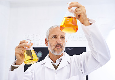 Buy stock photo Healthcare, chemical and mature man in lab, scientist and medical research for drug development and cure. Experimental, thinking and comparing of results, mpox and  liquid for chemistry in clinic