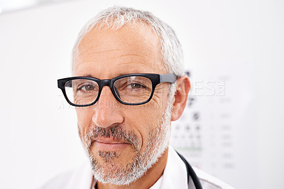 Buy stock photo Doctor, portrait and confidence in hospital for optometry, healthcare or medical service with glasses. Mature man, optometrist and smile in clinic for eye care, wellness or ocular health professional