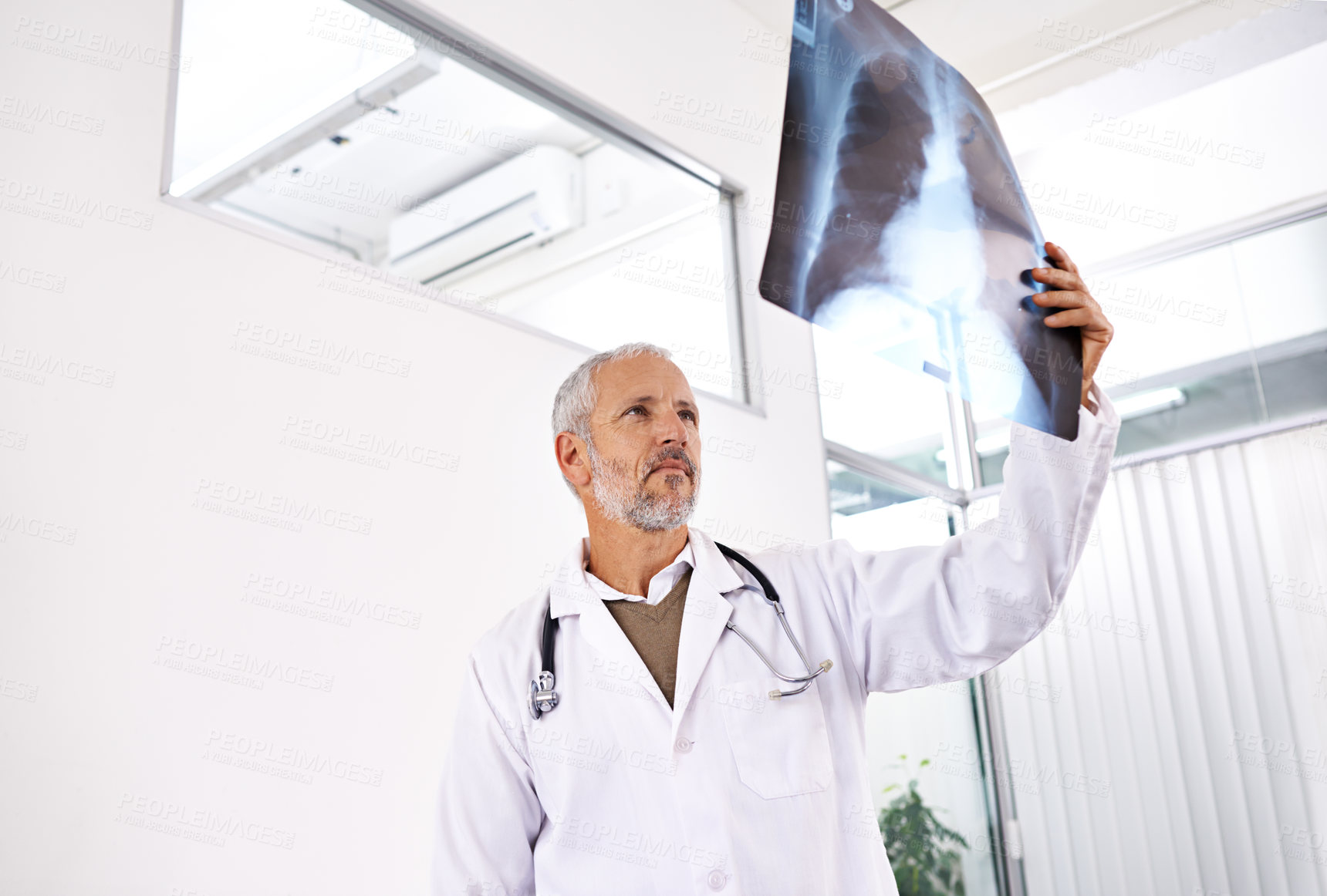 Buy stock photo Mri, radiology and thinking with doctor in hospital for medicine, healthcare and tumor detection. Medical, insurance and lung cancer with mature man and xray scan for pneumonia or disease screening